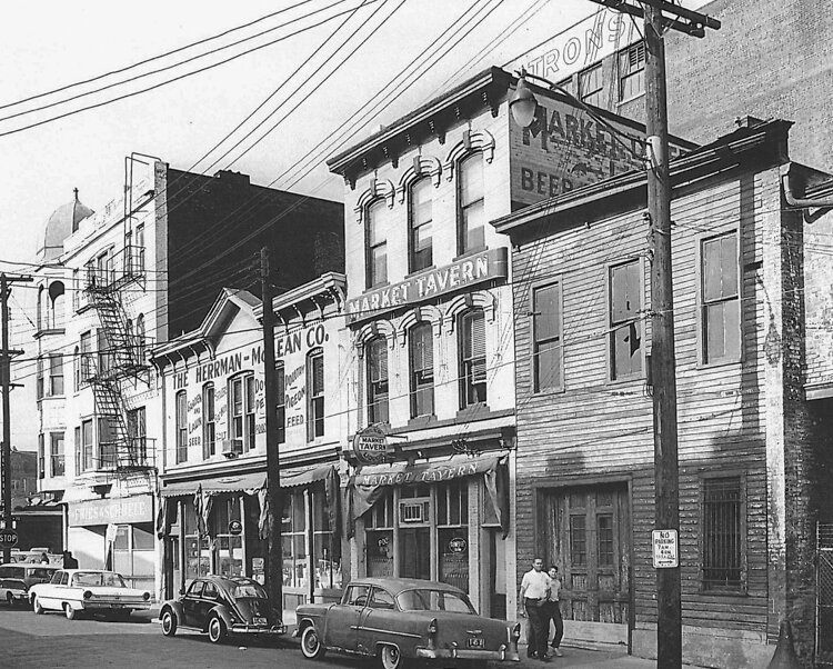 The three original buildings, shown here in 1963, were fused together when the Conways first began designing the Great Lakes Brewing space.